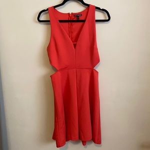 Women’s coral dress with the cutout sides